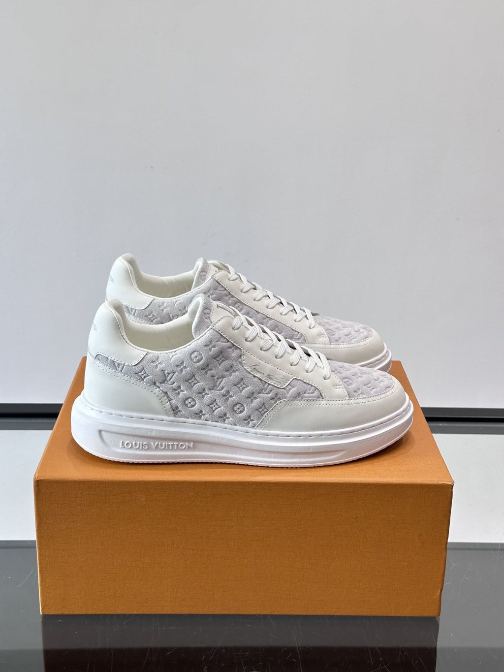 Louis Vuitton Embossed Low-Top Sneakers — front