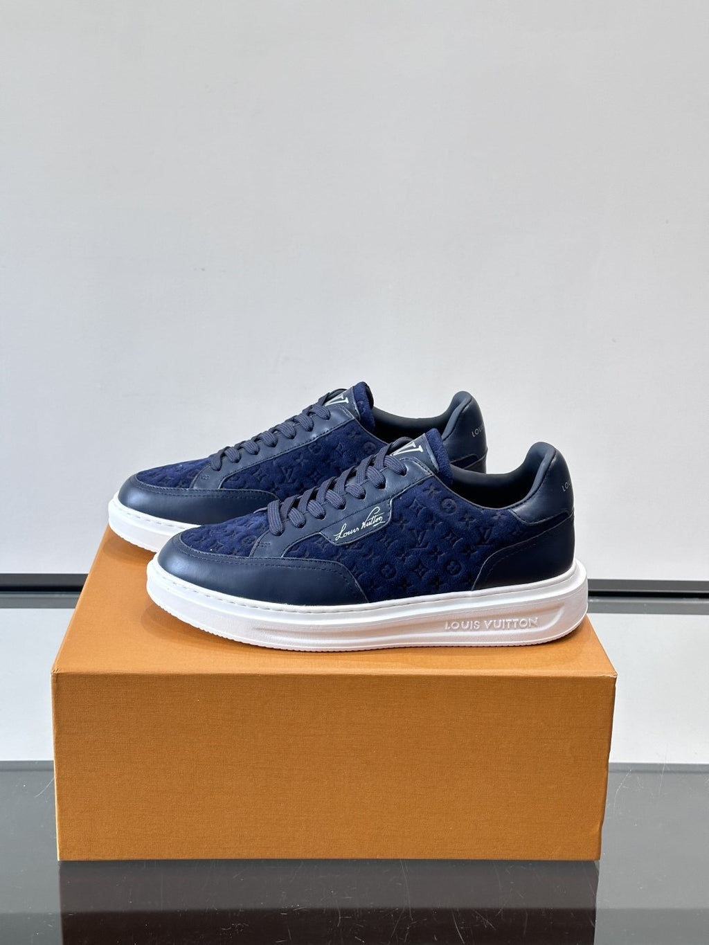 Louis Vuitton Embossed Low-Top Sneakers — side
