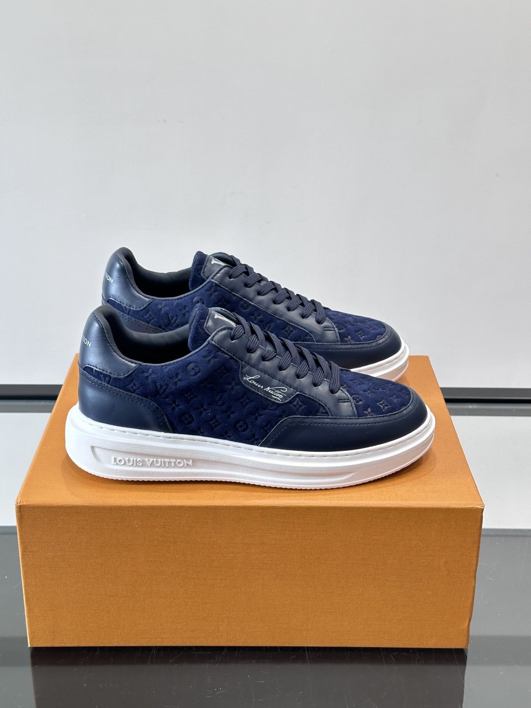 Louis Vuitton Embossed Low-Top Sneakers — front