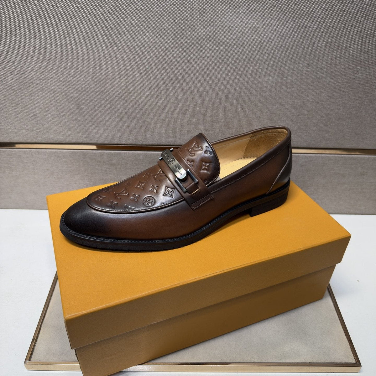 Louis Vuitton Embossed Metal-Bar Loafers — front