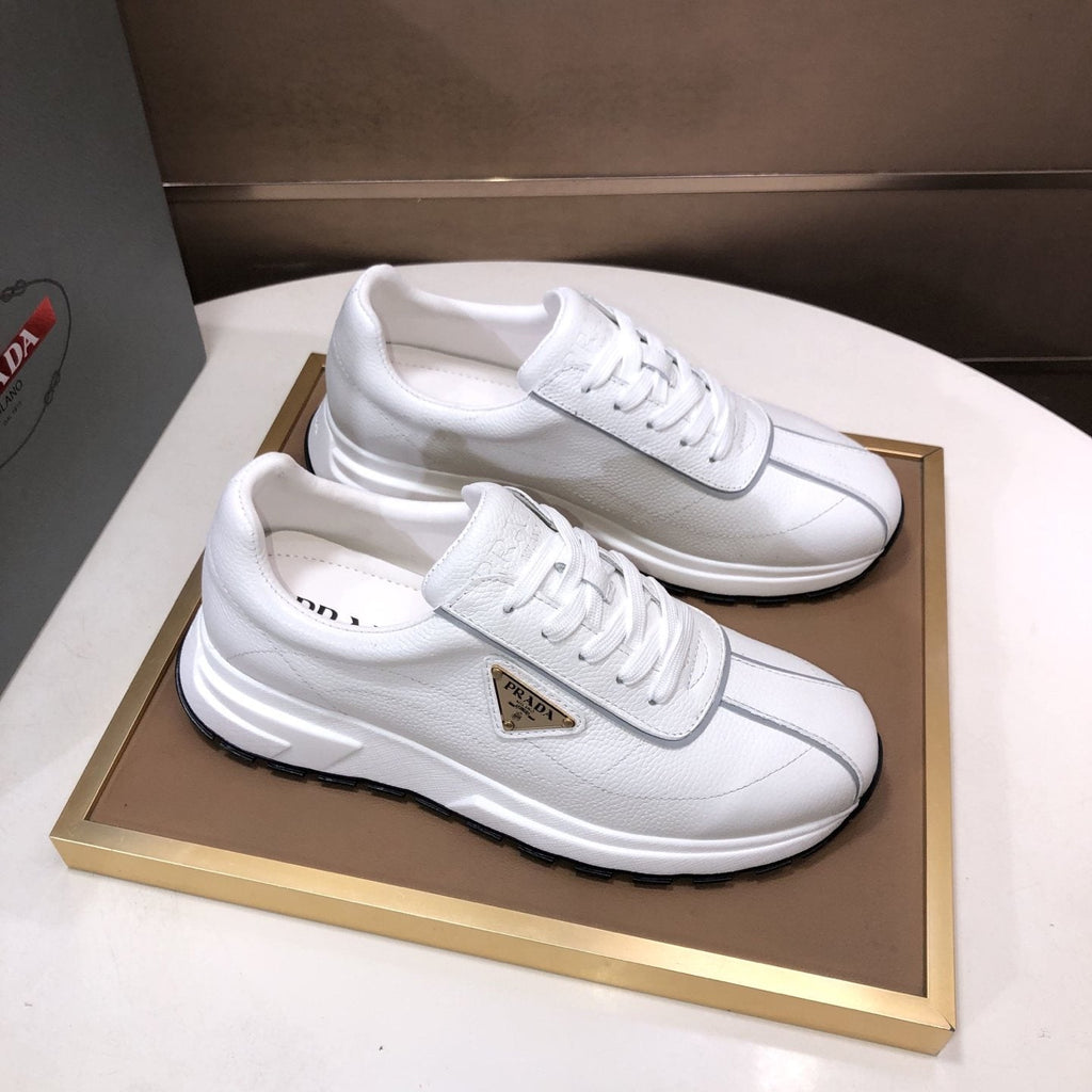 Prada Triangle Plaque Low-Top Sneakers — front