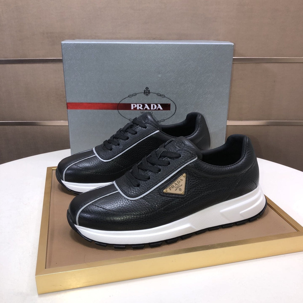 Prada Triangle Plaque Low-Top Sneakers — front
