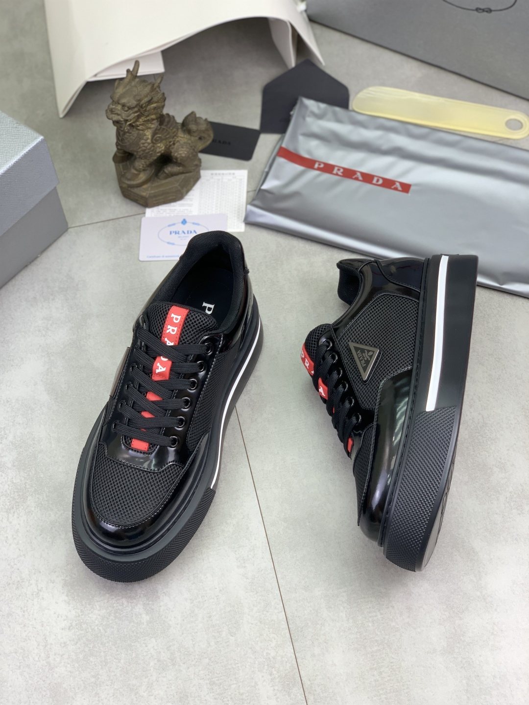 Prada Triangle Patch Low-Top Sneakers — side