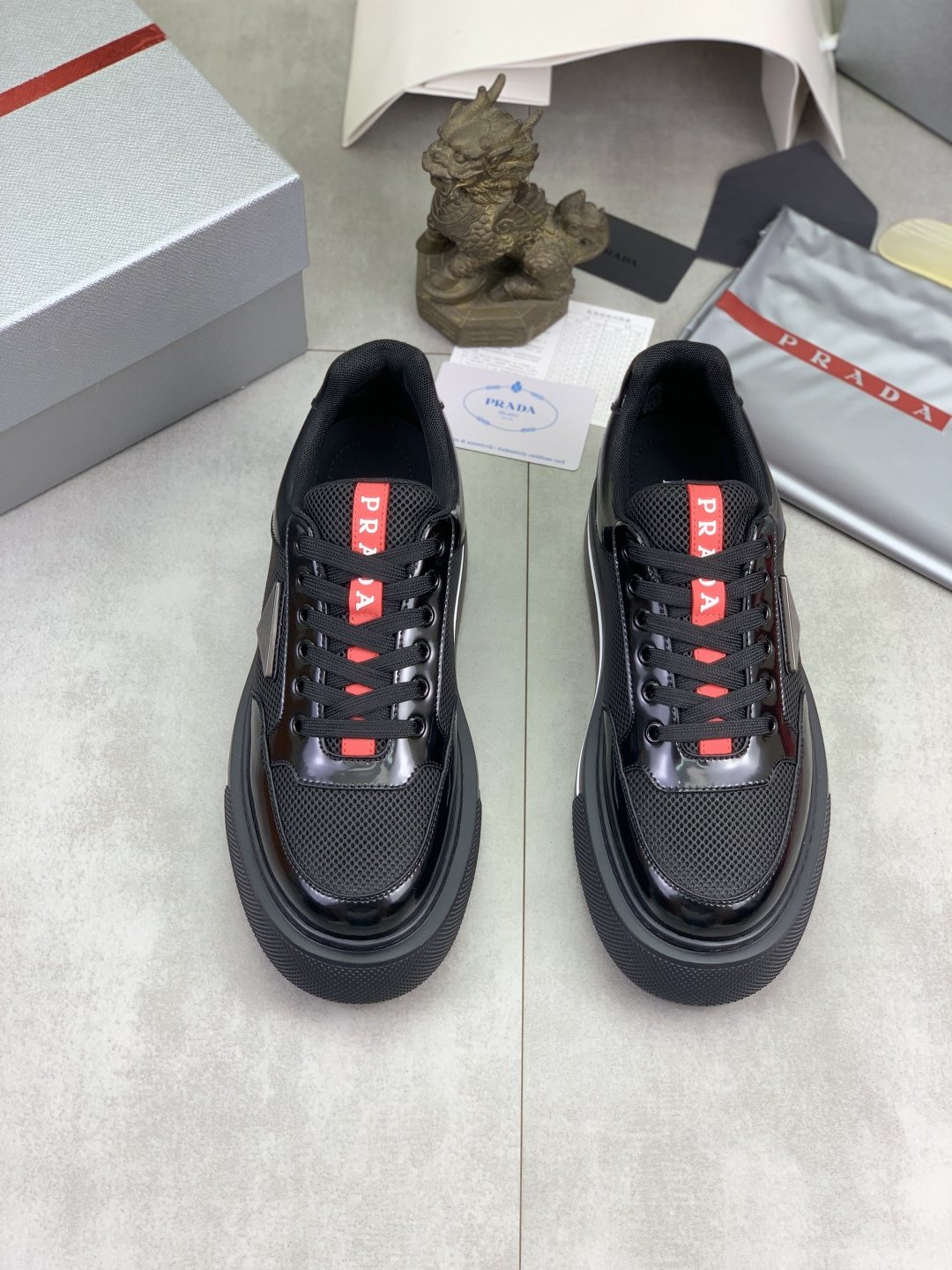 Prada Triangle Patch Low-Top Sneakers — front