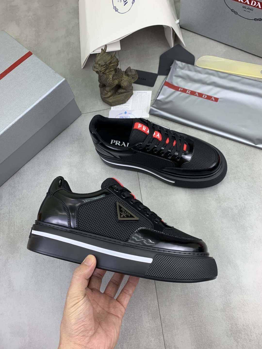 Prada Triangle Patch Low-Top Sneakers — side