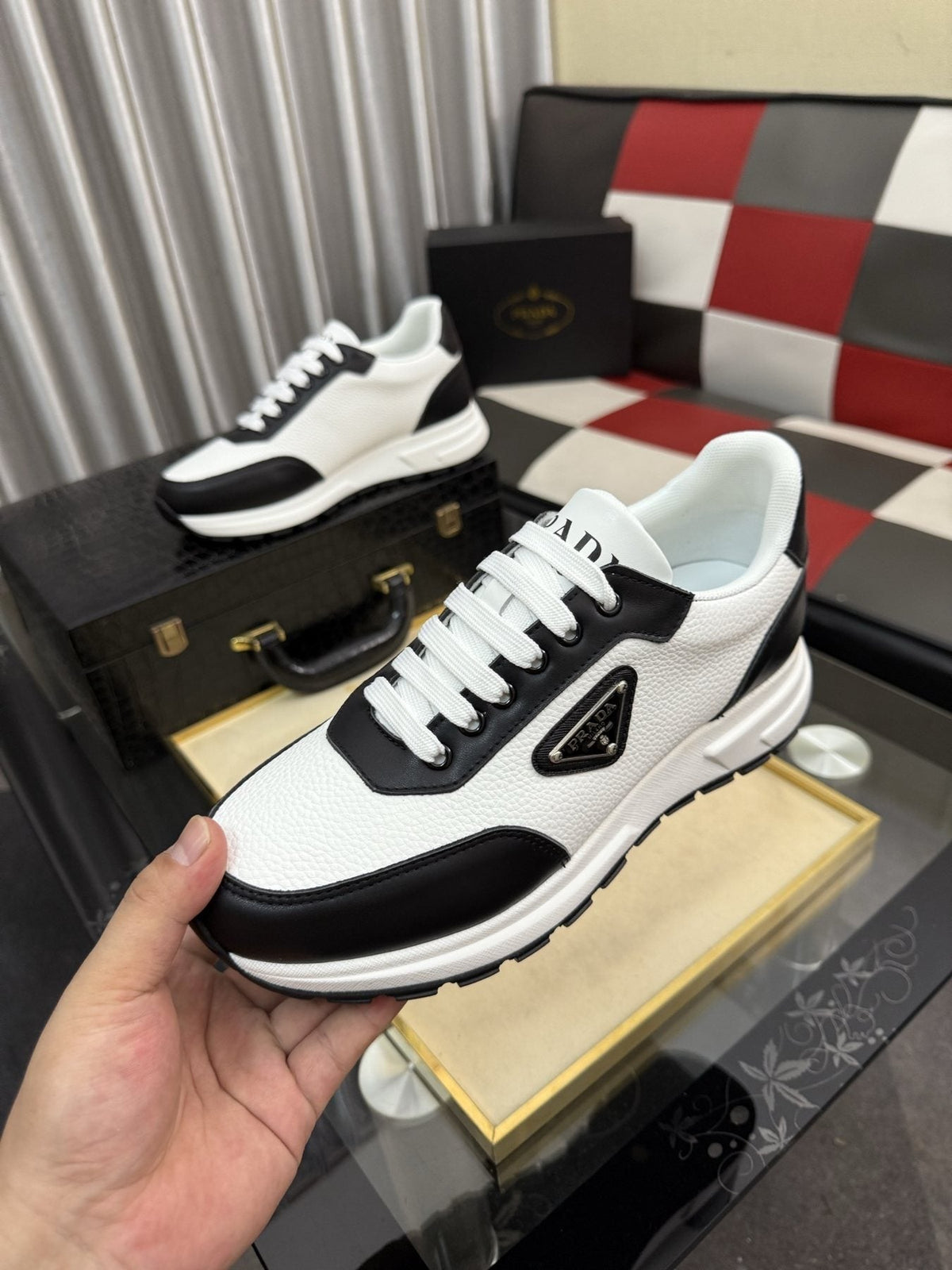 Prada Triangle Badge Low-Top Sneakers — model