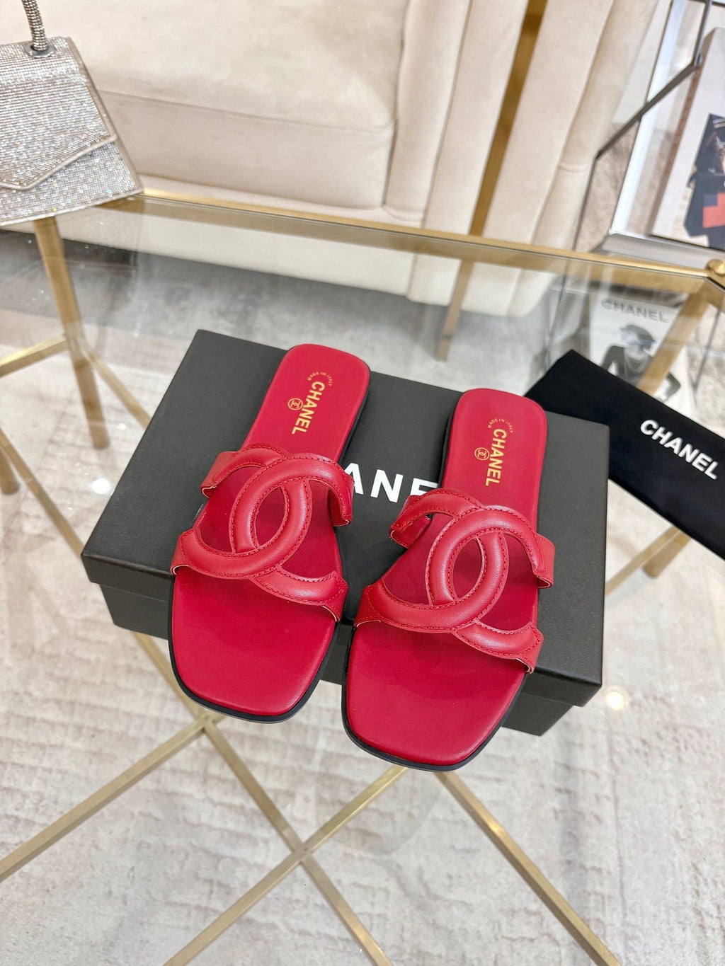 Chanel Embossed Logo Slide Sandals — hero
