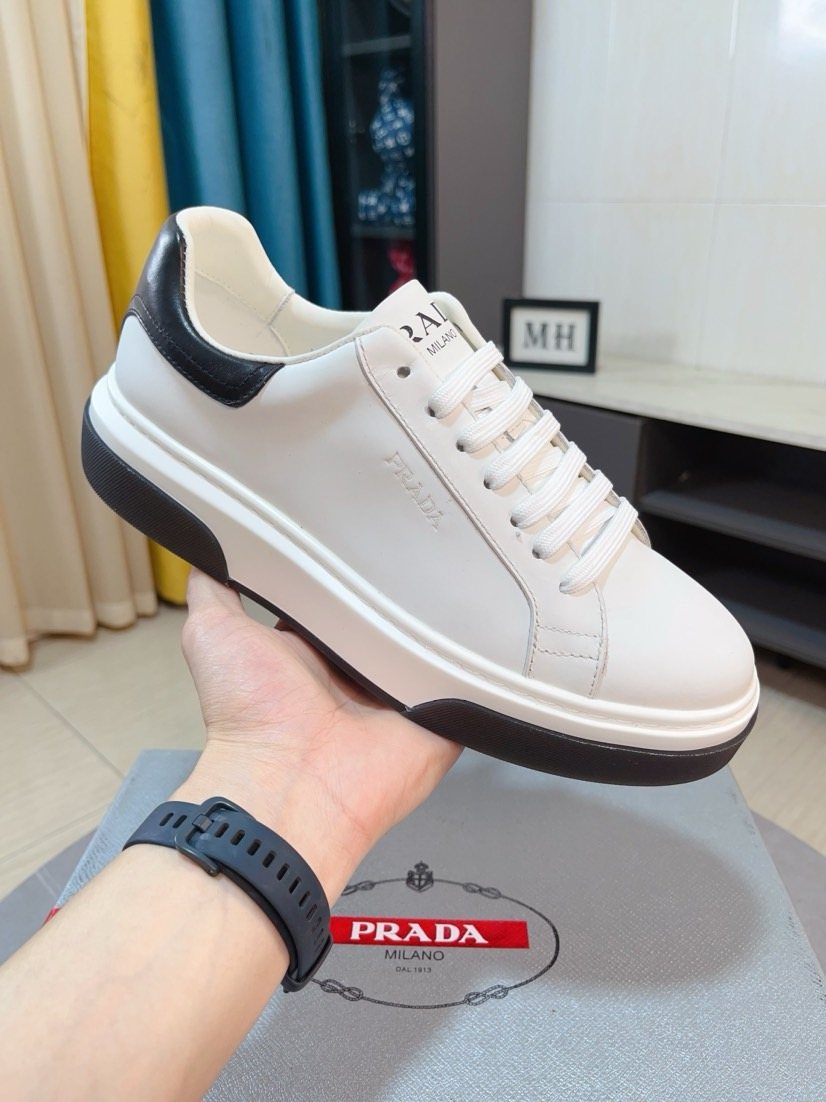 Prada Triangle Patch Low-Top Sneakers — model
