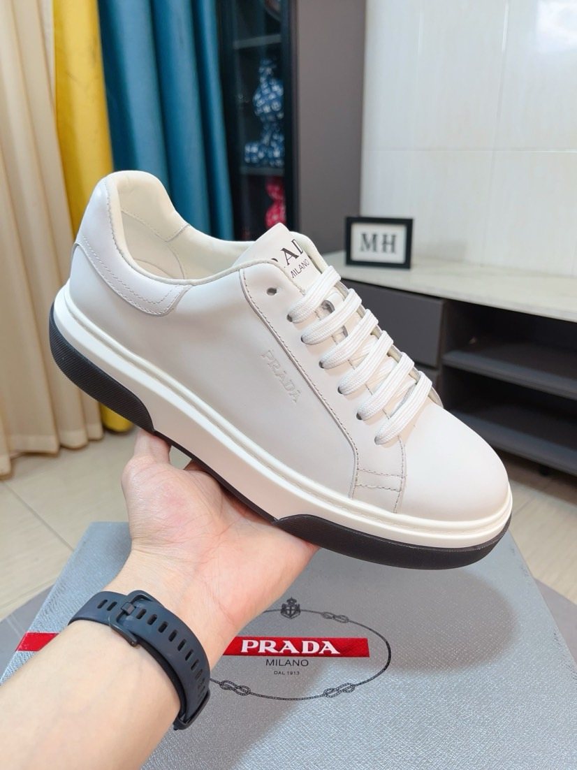 Prada Triangle Patch Low-Top Sneakers — model