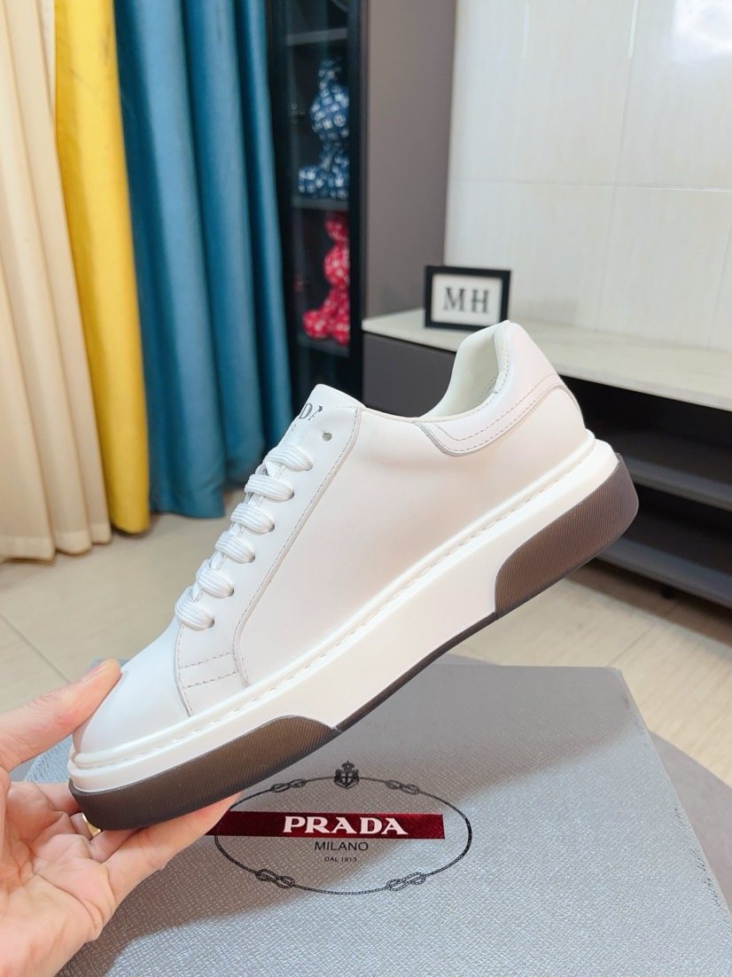 Prada Triangle Patch Low-Top Sneakers — model