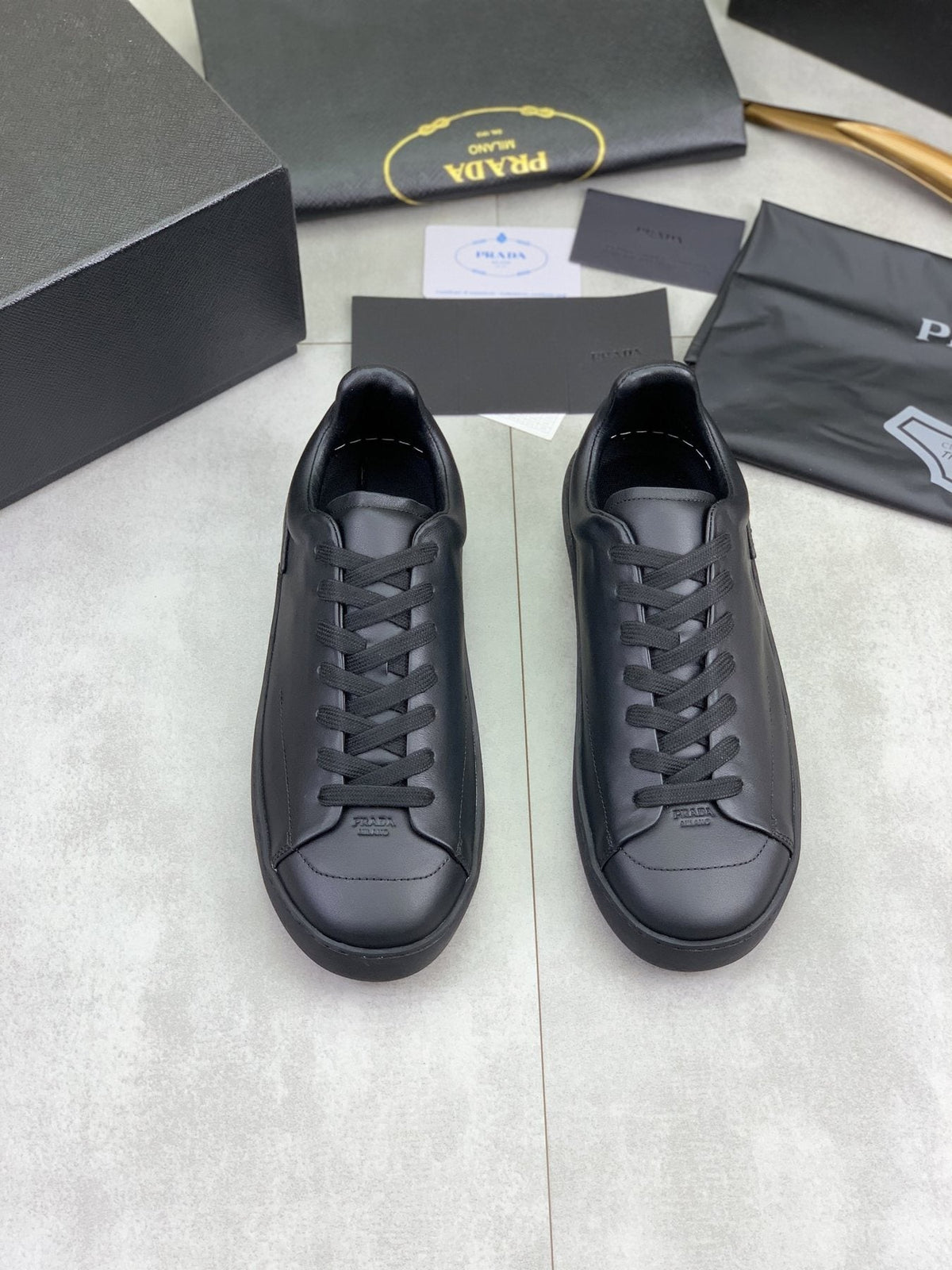 PRADA Triangle Accent Low-Top Sneakers — front