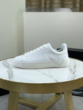 PRADA Triangle Accent Low-Top Sneakers — hero