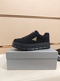 Prada Triangle Plaque Low-Top Sneakers — hero