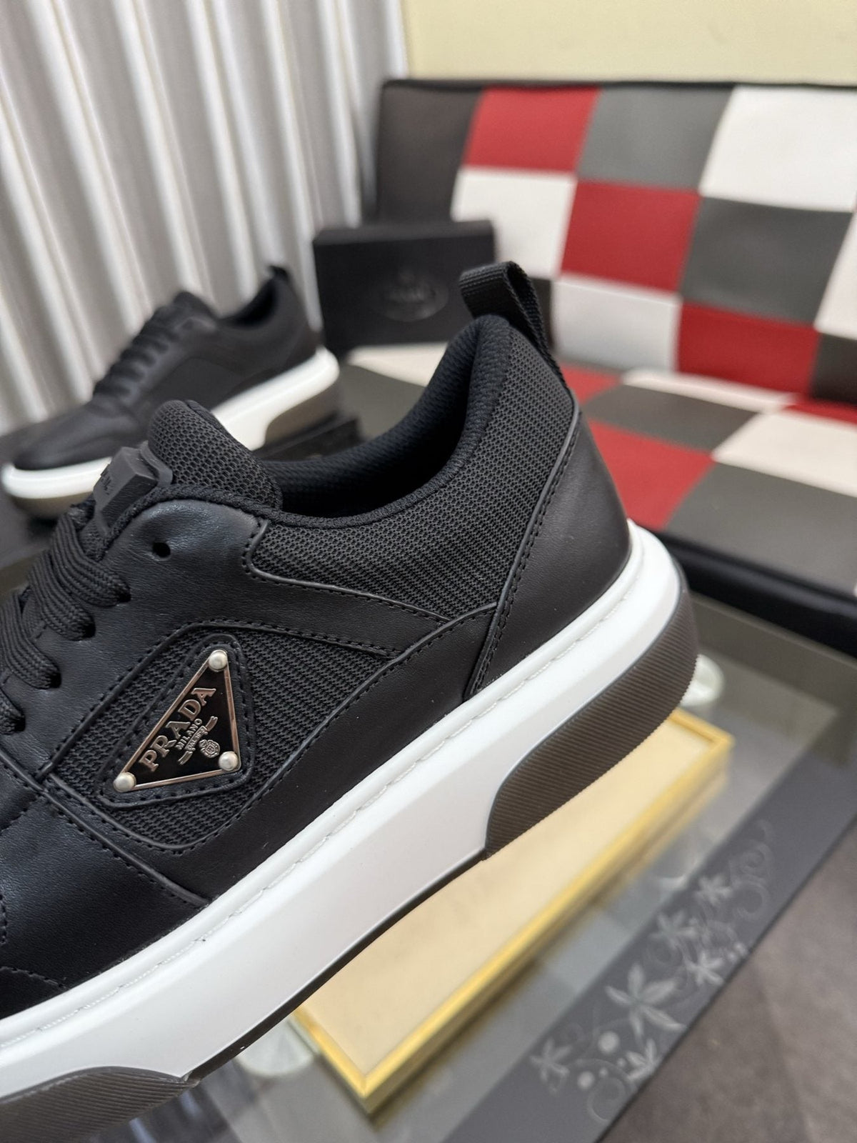 Prada Triangle Plaque Low-Top Sneakers — detail