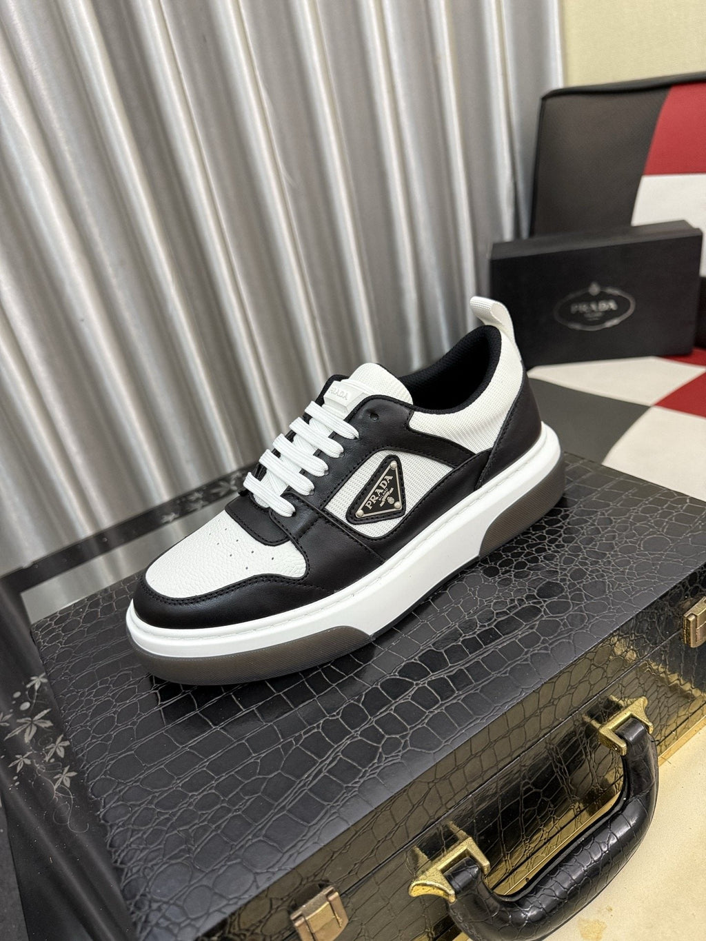 Prada Triangle Plaque Low-Top Sneakers — hero