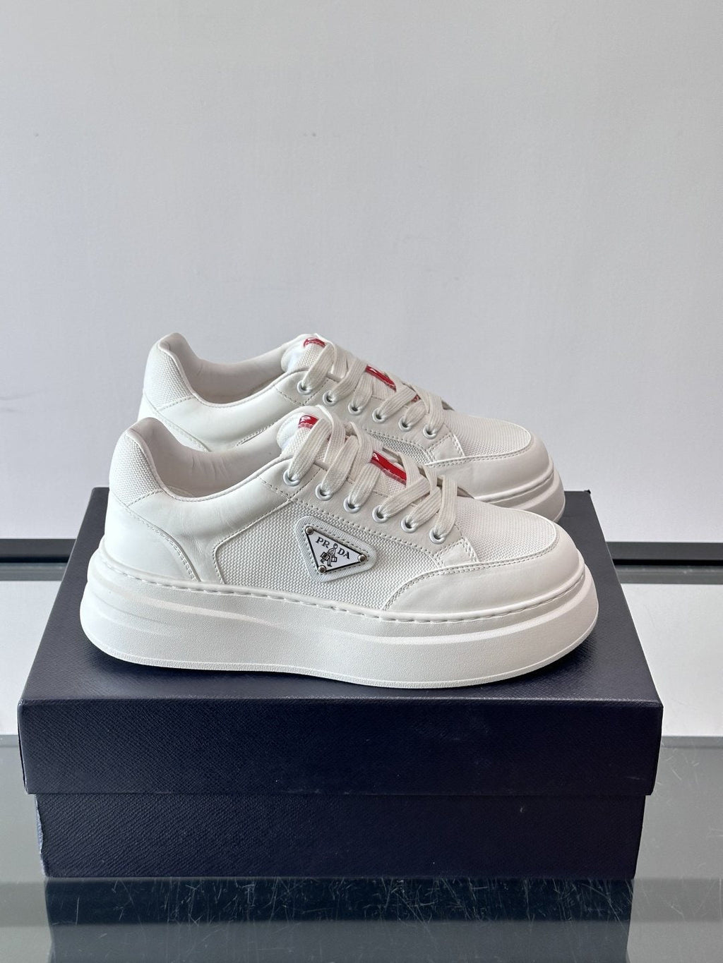 Prada Triangle Detail Low-Top Sneakers — hero