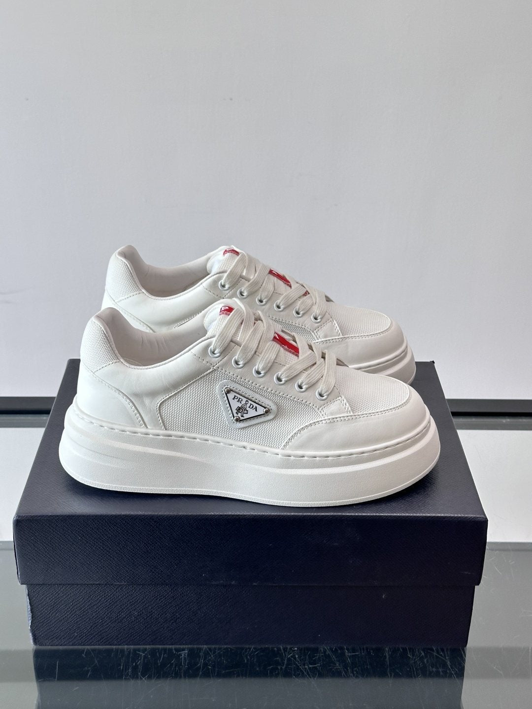 Prada Triangle Detail Low-Top Sneakers — hero