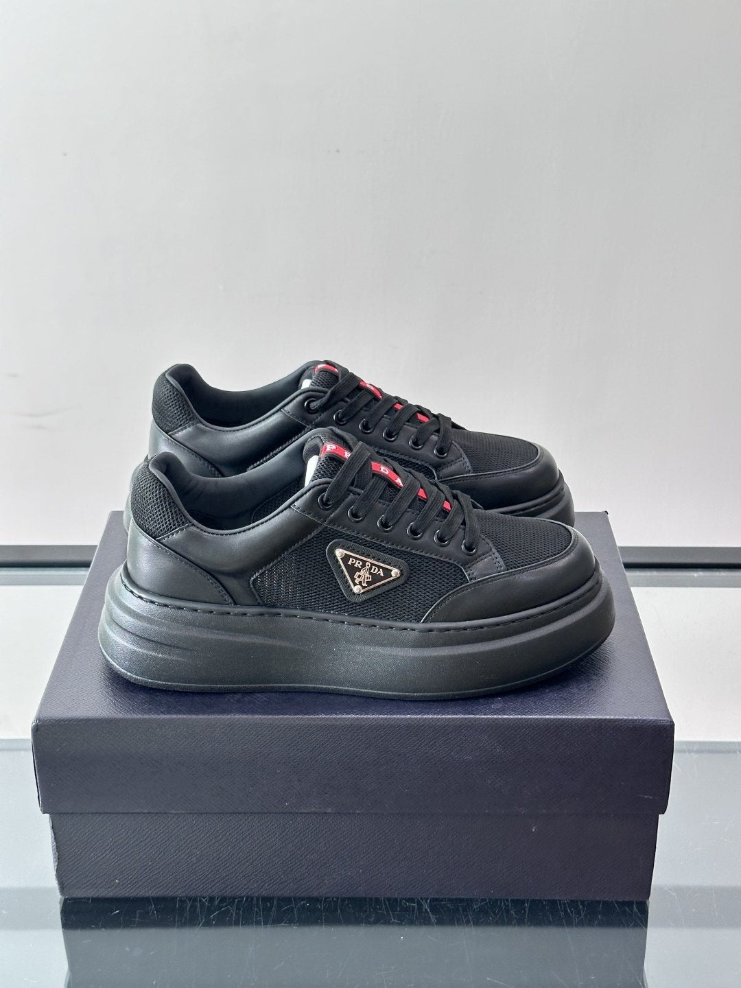 Prada Triangle Detail Low-Top Sneakers — side