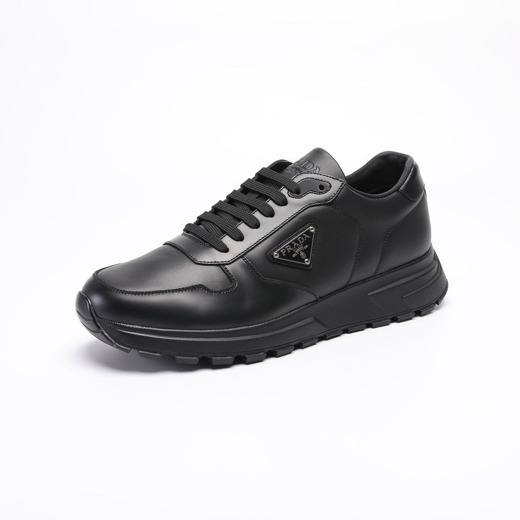 Prada Triangle Plaque Low-Top Sneakers — hero