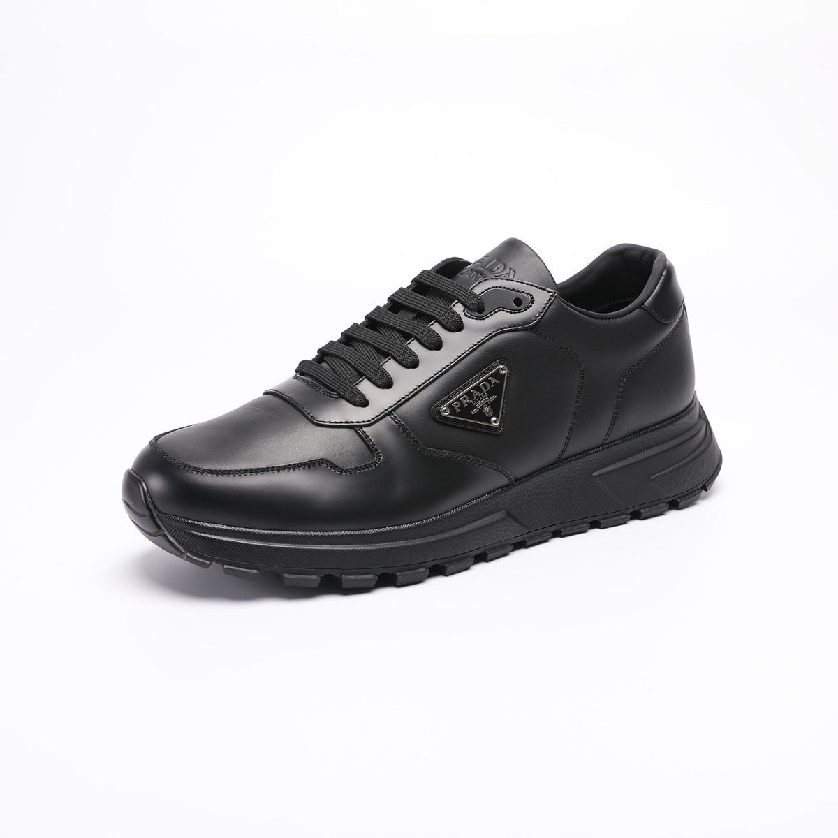 Prada Triangle Plaque Low-Top Sneakers — hero