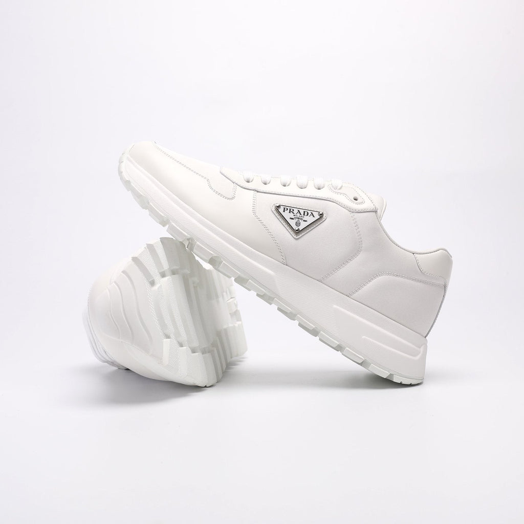 Prada Triangle Plaque Low-Top Sneakers — front