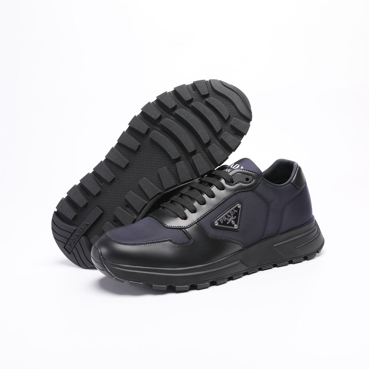 Prada Triangle Plaque Low-Top Sneakers — side