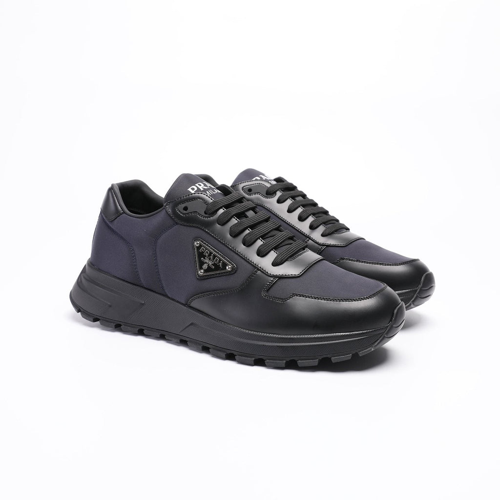 Prada Triangle Plaque Low-Top Sneakers — front