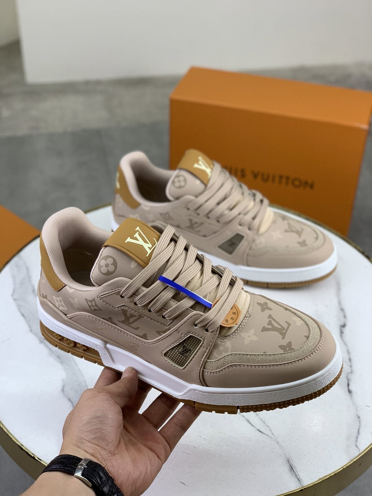 Louis Vuitton Beige, White & Gold Low-Top Sneakers — model