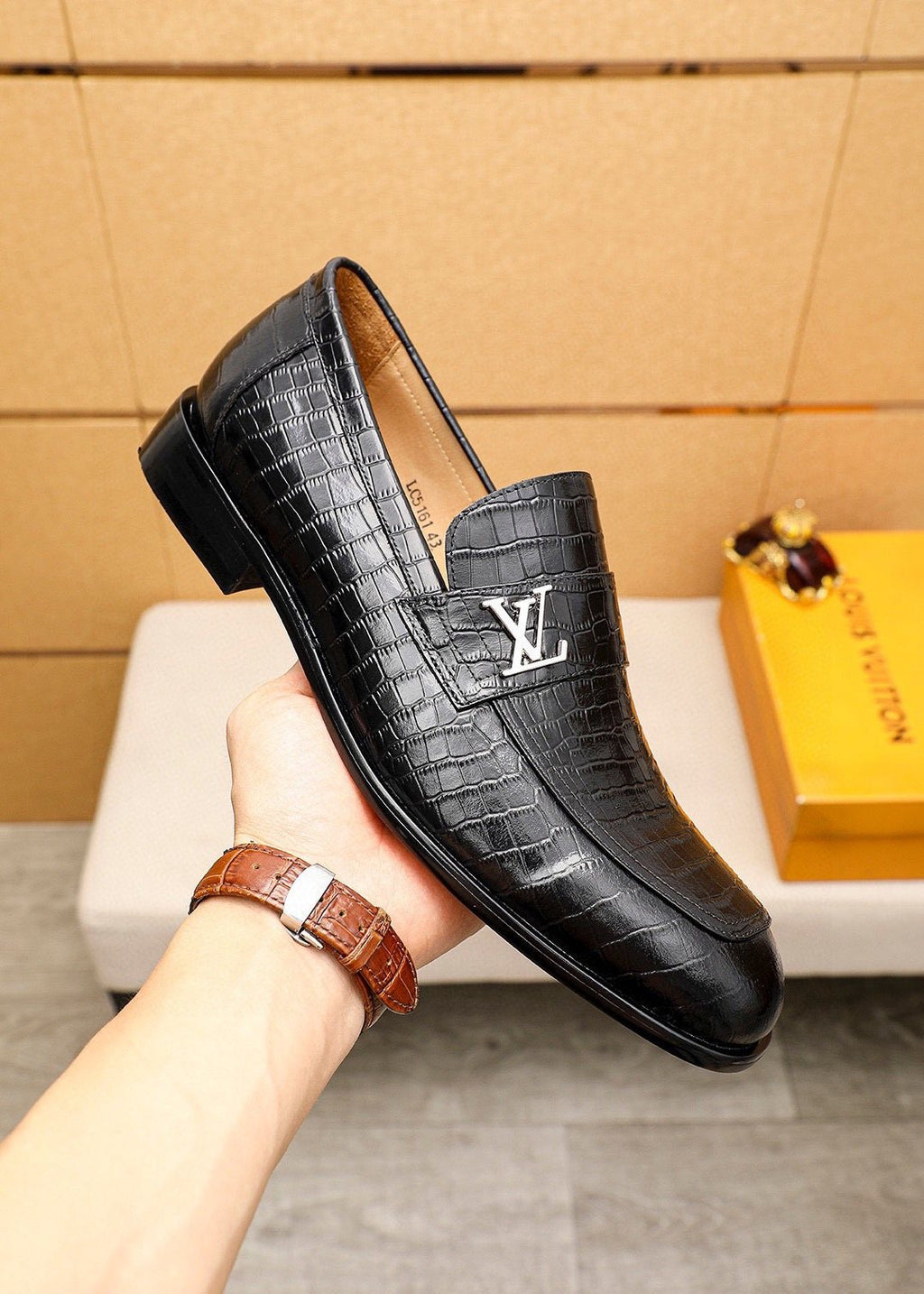 Louis Vuitton Embossed Metal-Accent Loafers — model