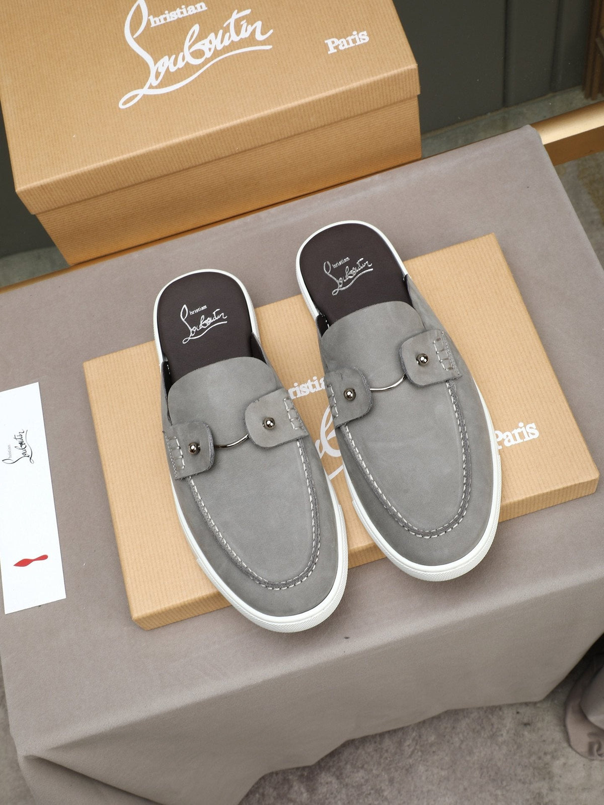 Christian Louboutin Buckle-Strap Slip-On Mules — hero