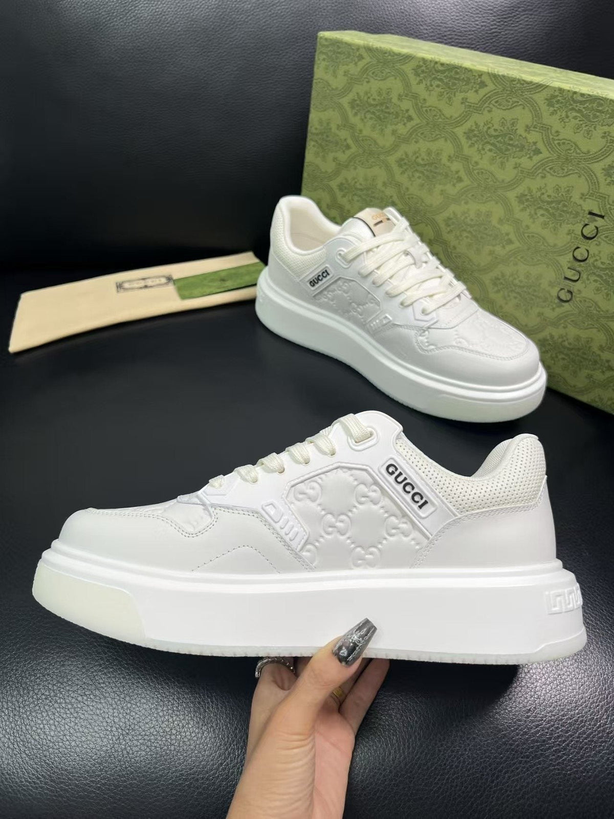 Gucci Embossed Low-Top Sneakers — detail