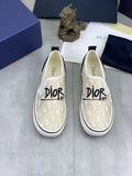 Dior Ivory Canvas Slip-On Sneakers — hero