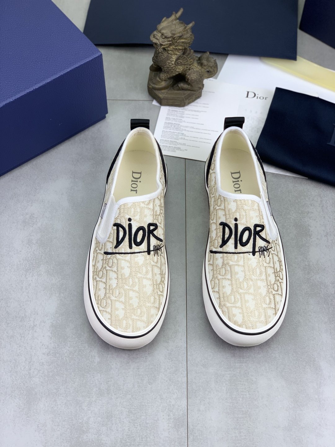 Dior Ivory Canvas Slip-On Sneakers — hero
