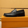 Louis Vuitton Embossed Buckle Loafers — hero