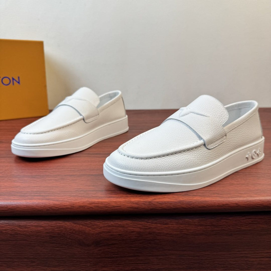 Louis Vuitton Textured Slip-On Loafers — front