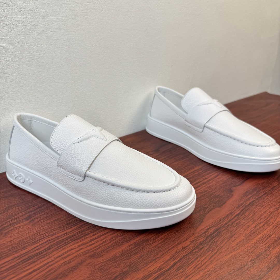 Louis Vuitton Textured Slip-On Loafers — front