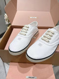 Miu Miu Low-Top Canvas Sneakers — hero