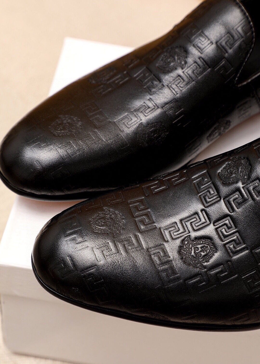 Versace Embossed Leather Slip-On Shoes — detail