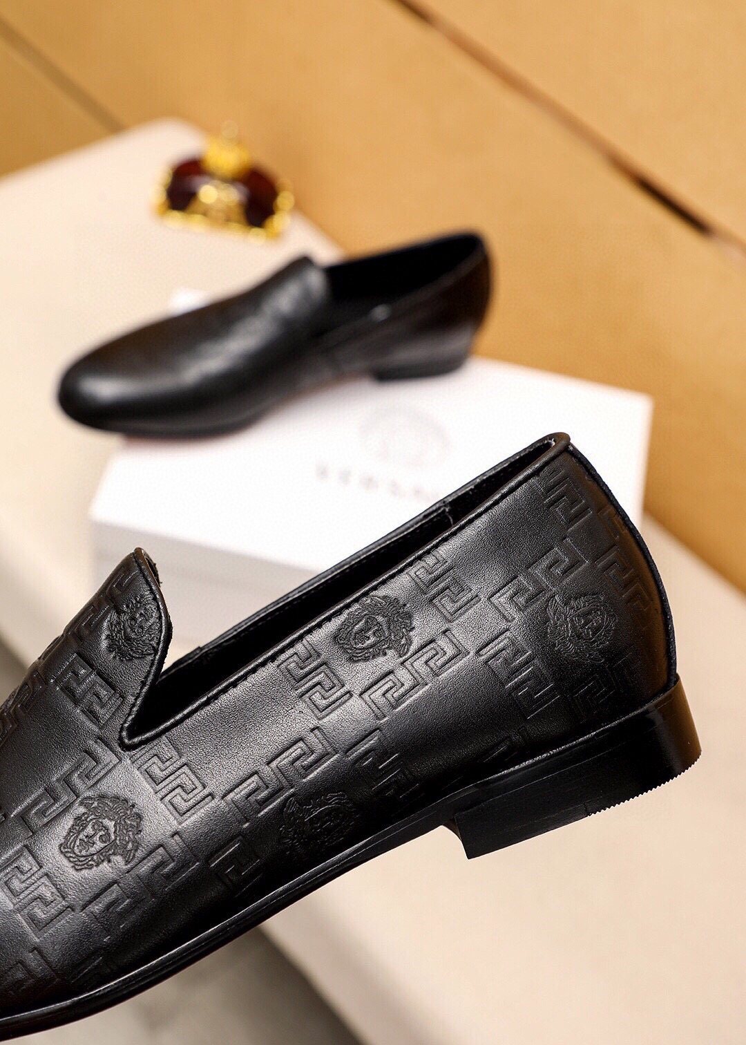 Versace Embossed Leather Slip-On Shoes — detail