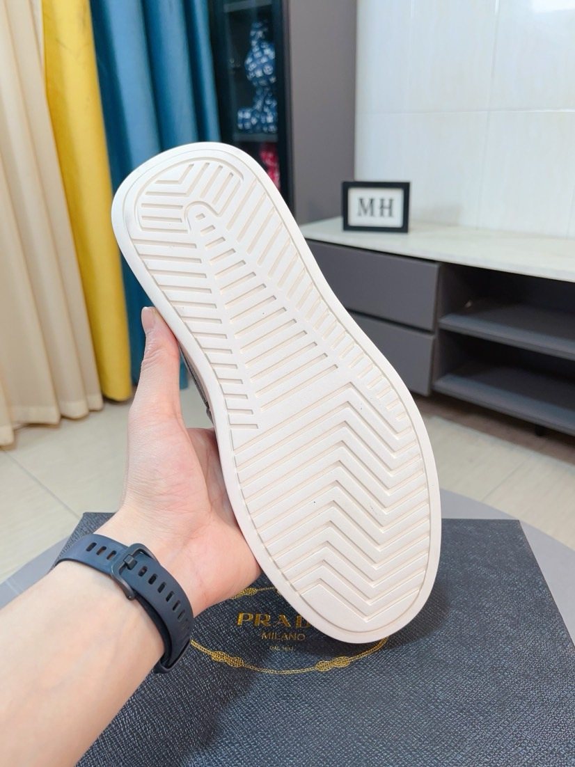 Prada Textured Slip-On Shoes — side