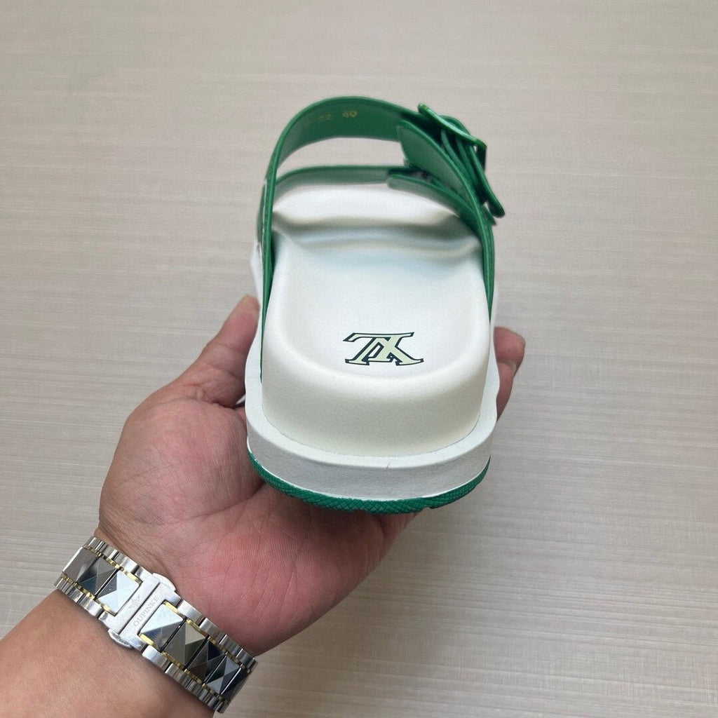 Louis Vuitton Double-Buckle Slide Sandals — model