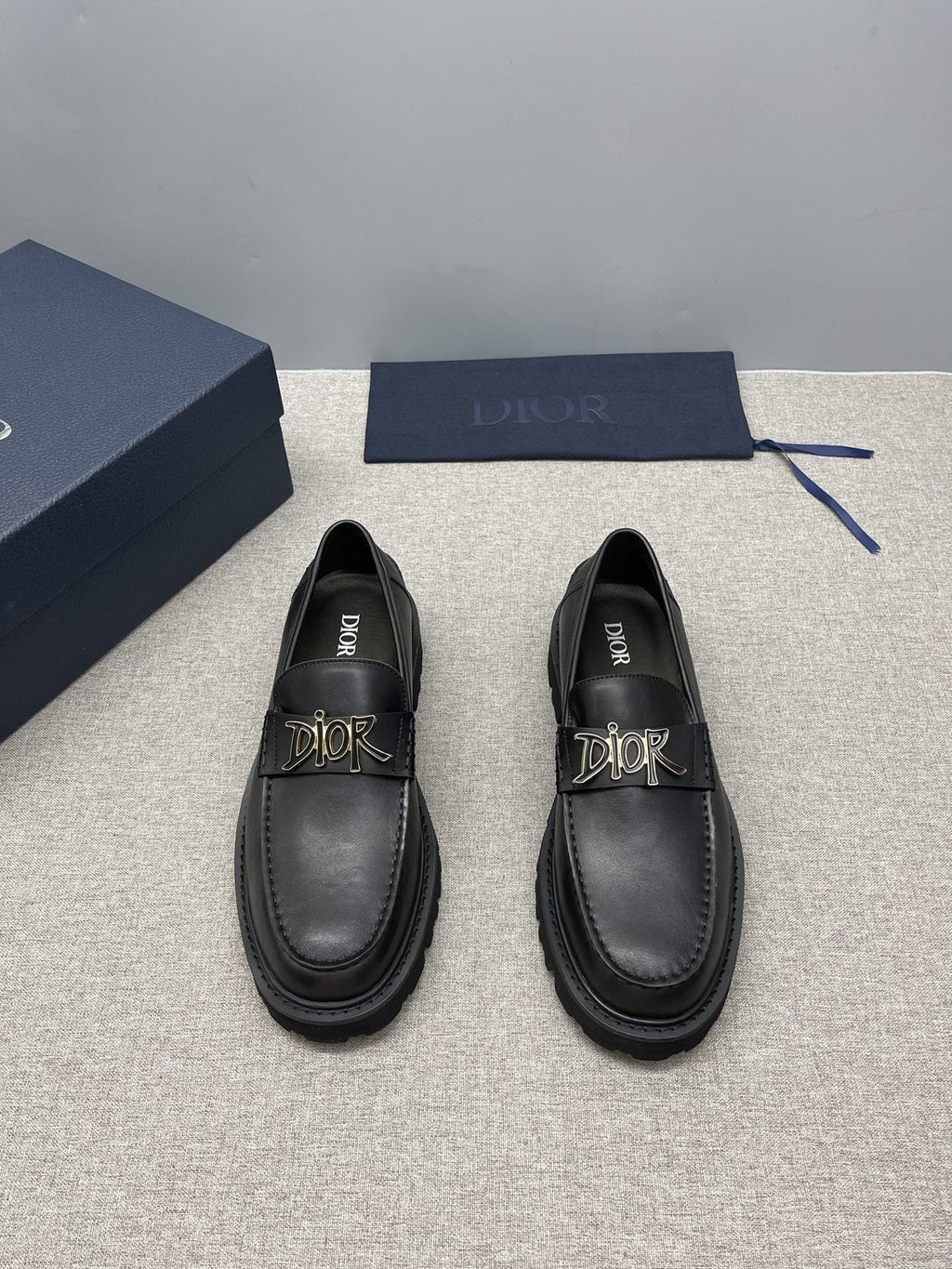 Dior Black Gold-Plaque Slip-On Shoes — front
