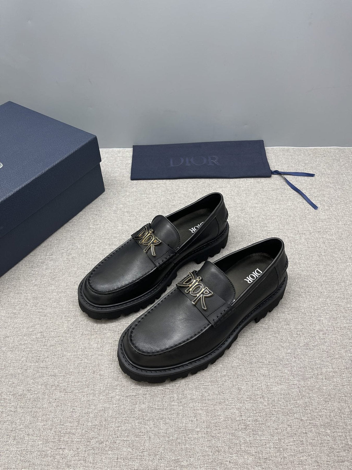 Dior Black Gold-Plaque Slip-On Shoes — front