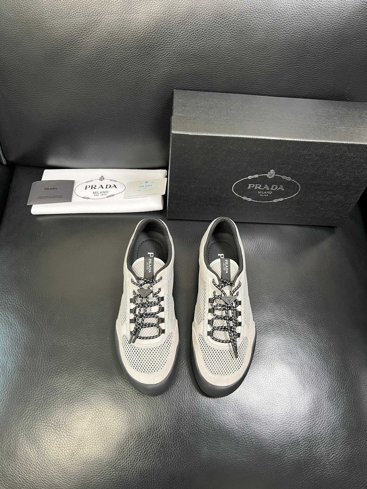Prada White, Gray & Black Low-Top Sneakers — front