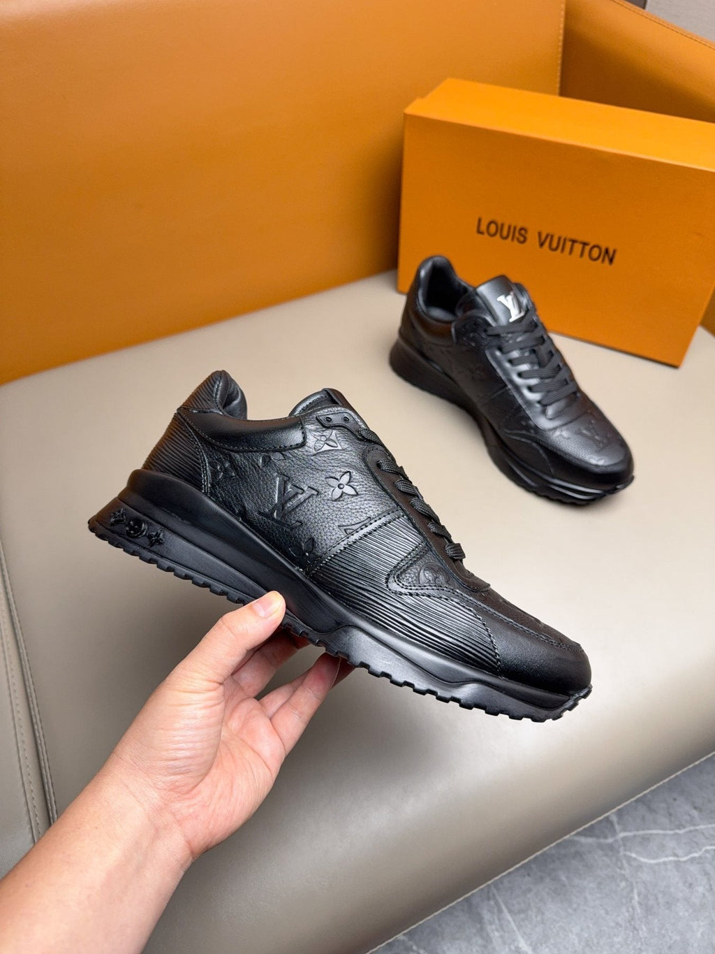 Louis Vuitton Embossed Low-Top Sneakers — front