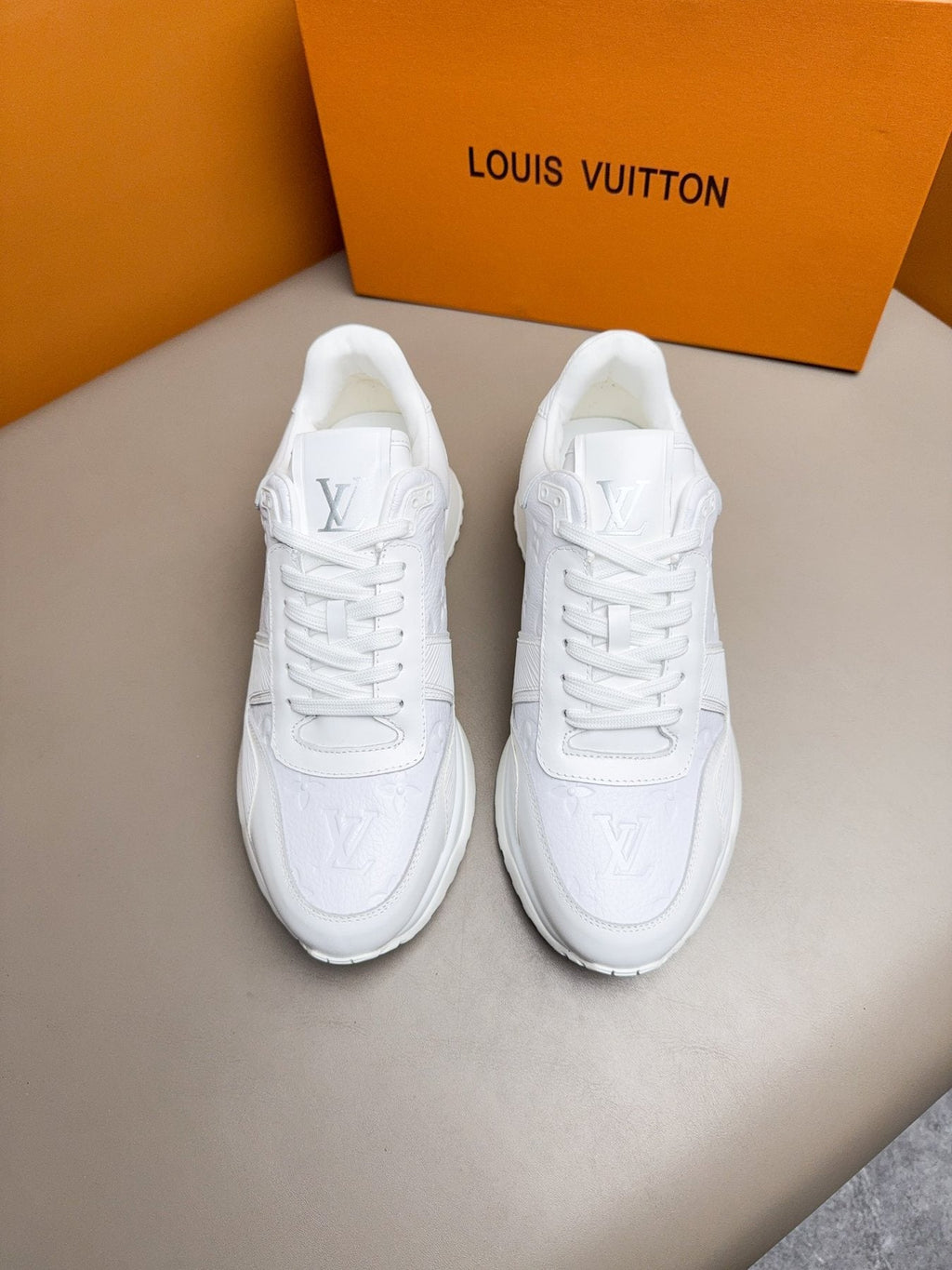 Louis Vuitton Embossed Low-Top Sneakers — front