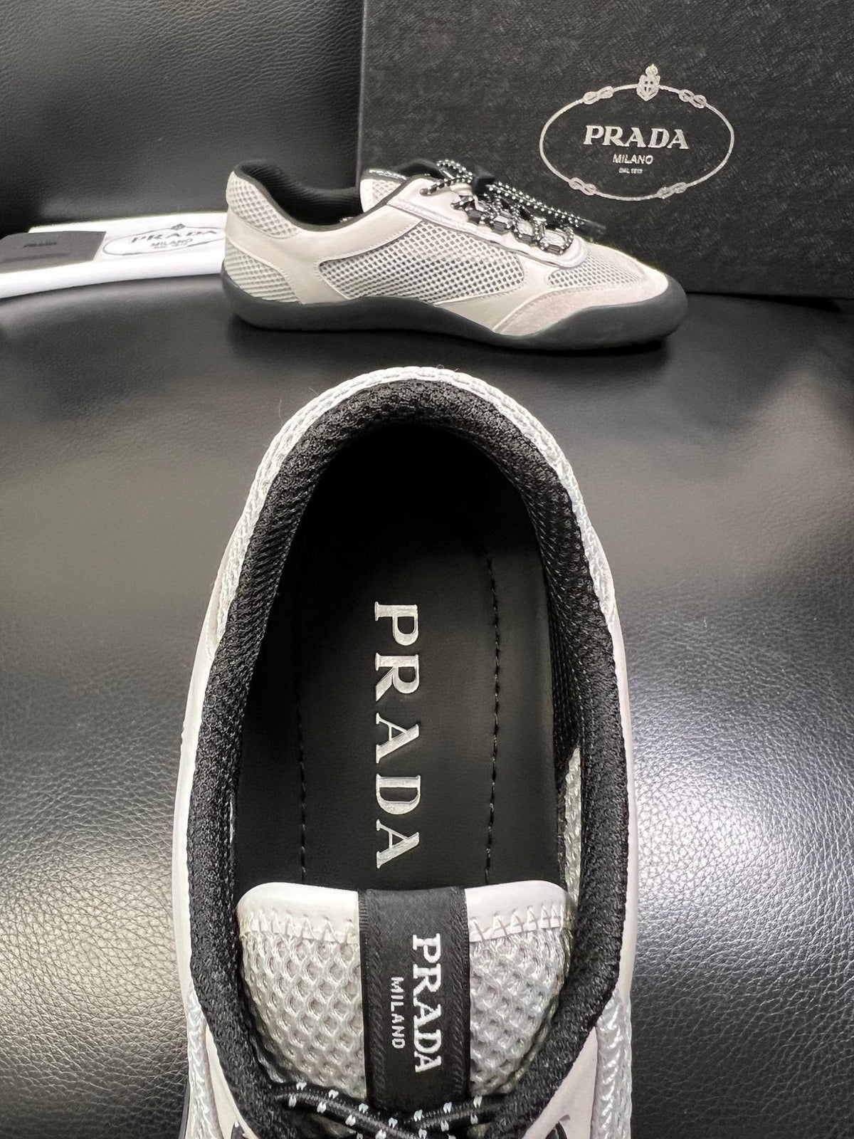 Prada Off-White Perforated Sneakers — detail