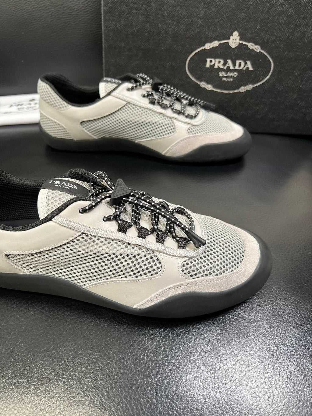 Prada Off-White Perforated Sneakers — detail