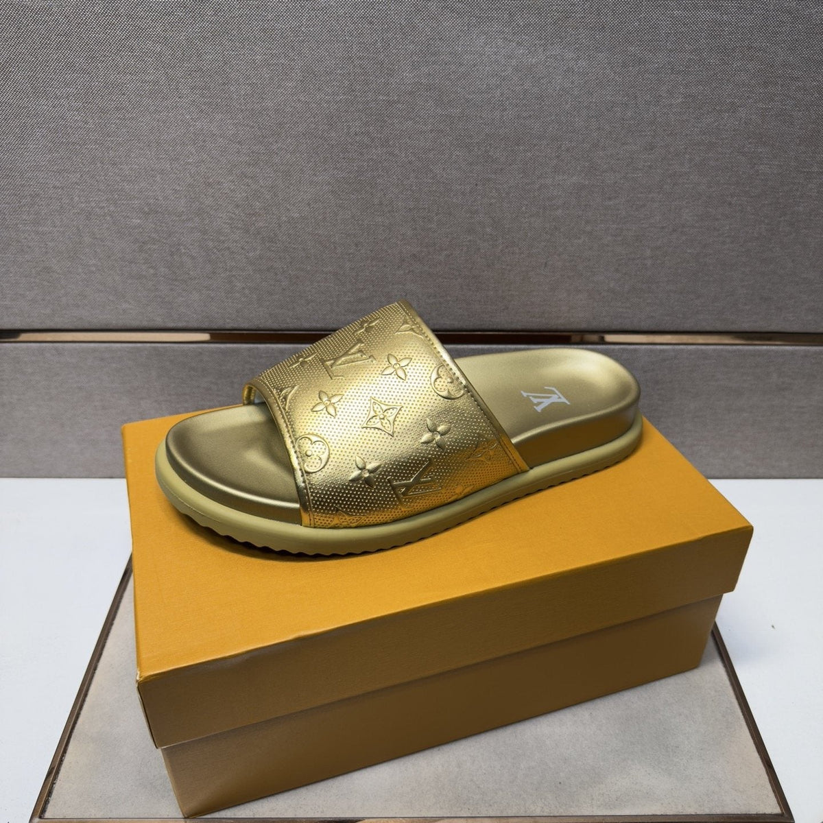 Louis Vuitton Embossed Metallic Slide Sandals — front