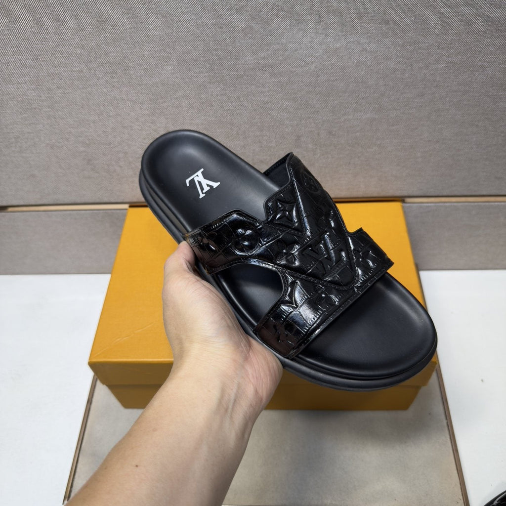 Louis Vuitton Textured Monogram Slide Sandals — model
